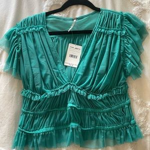 Free People top never worn.  Brand new with tags